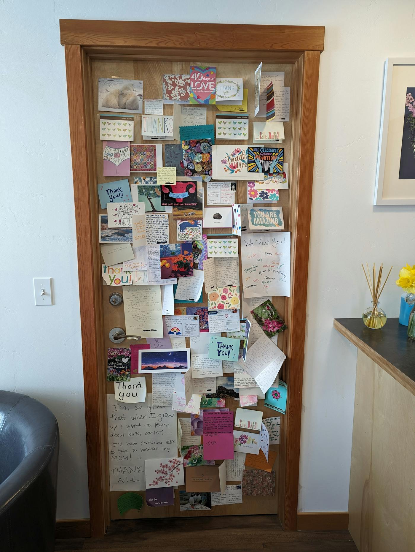 A door covered with thank-you notes at All Families Healthcare