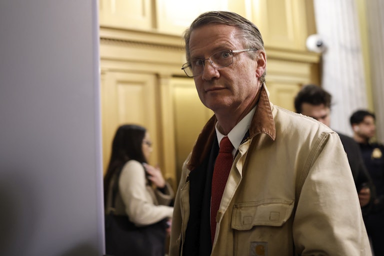 Representative Tim Burchett looks directly at the camera as he leaves the House chambers in the Capitol.