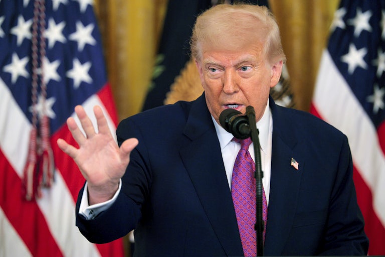 Donald Trump speaking and making a hand gesture