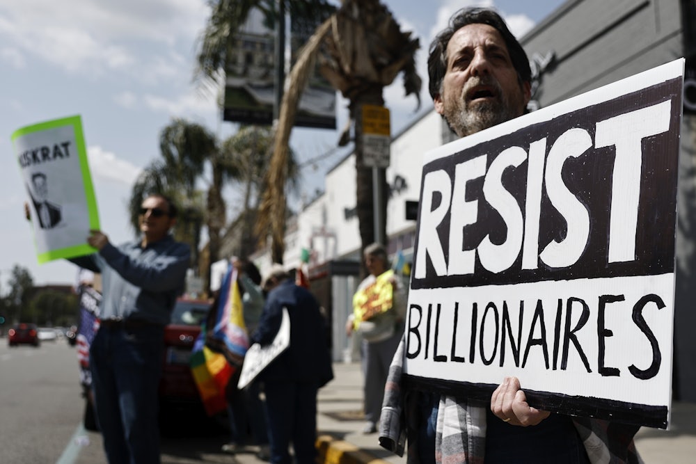 A protest outside a Tesla dealership