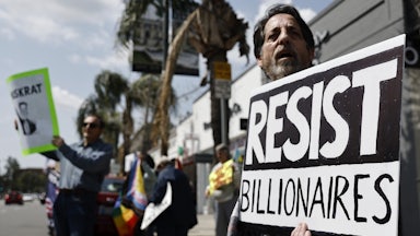 A protest outside a Tesla dealership