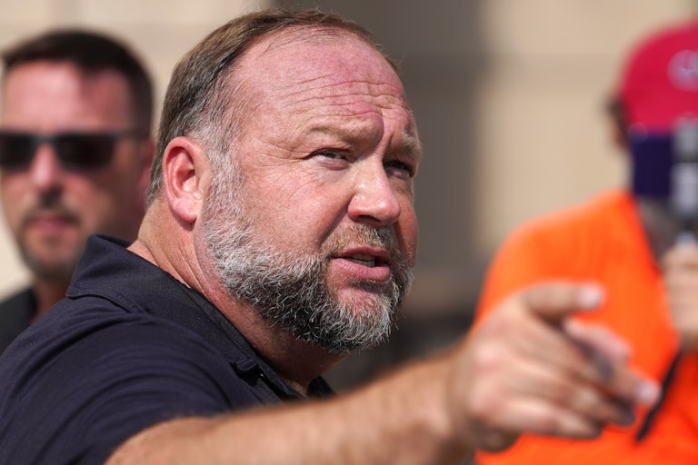 Alex Jones points and speaks