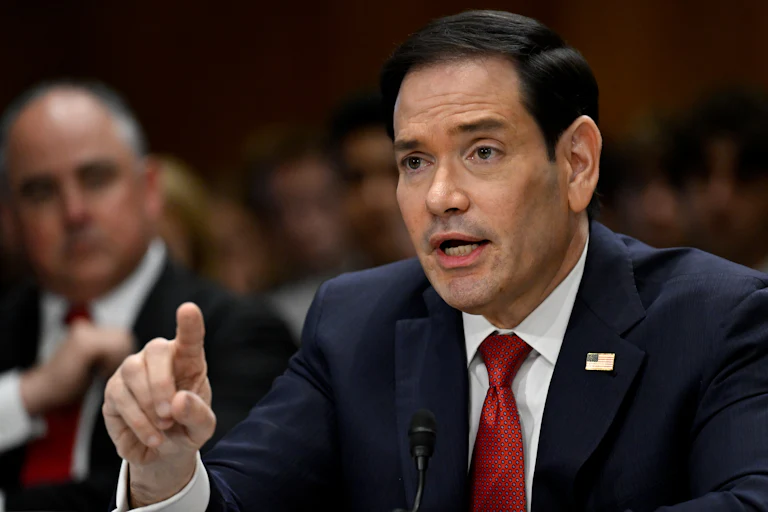Secretary of State Marco Rubio gestures with a finger while speaking during a Senate hearing