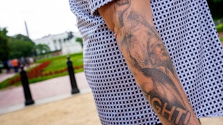 A tattoo depicting the assassination attempt on Donald Trump on the arm of Oath Keepers founder Stewart Rhodes