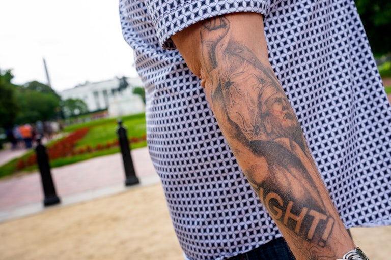 A tattoo depicting the assassination attempt on Donald Trump on the arm of Oath Keepers founder Stewart Rhodes