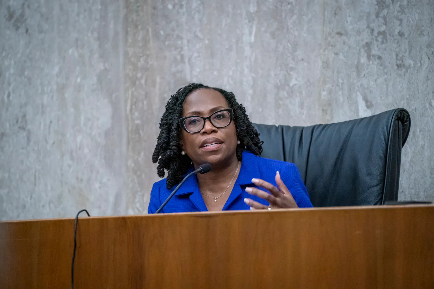 Supreme Court Justice Ketanji Brown Jackson speaks at a dais