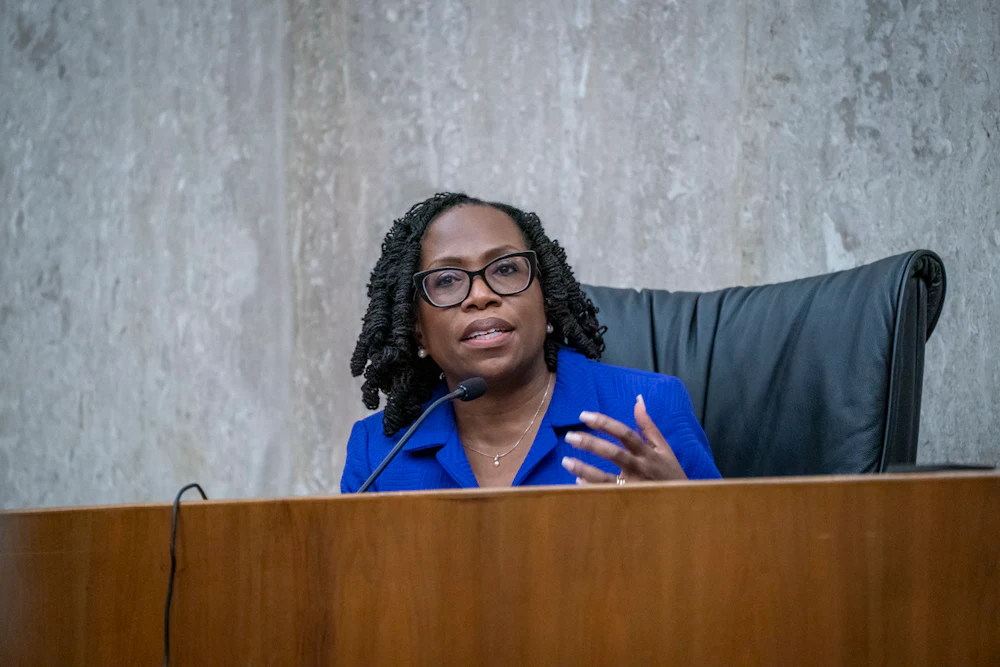 Supreme Court Justice Ketanji Brown Jackson speaks at a dais