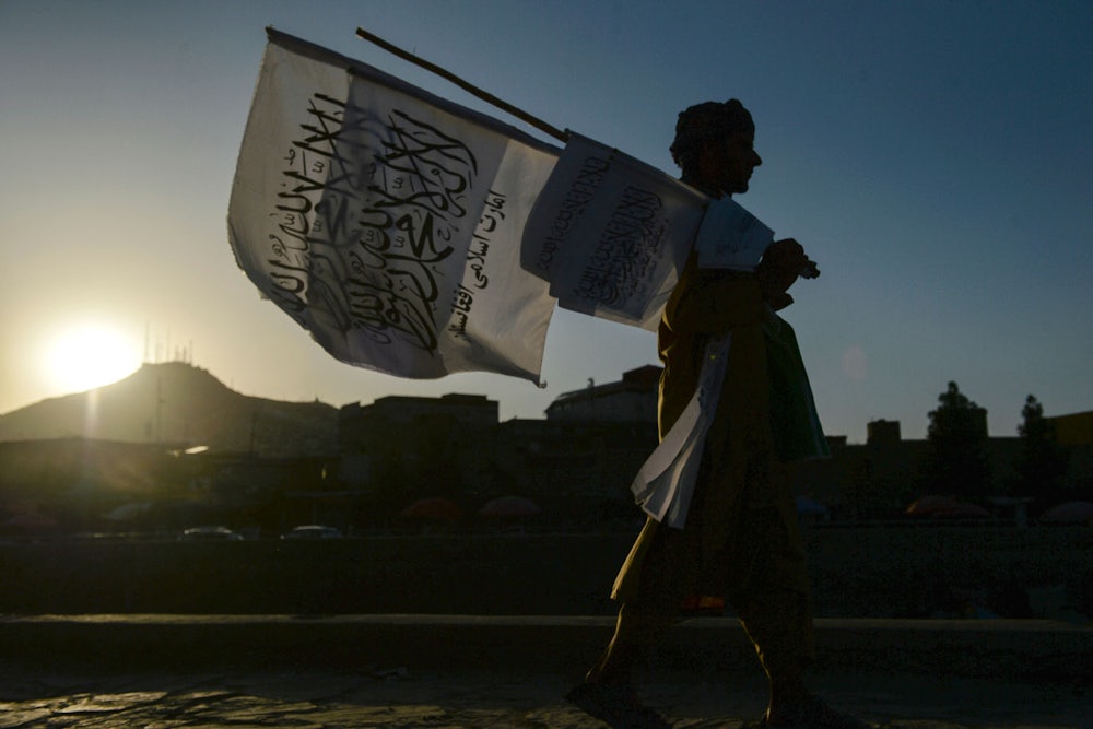 A man sells Taliban flags in Kabul