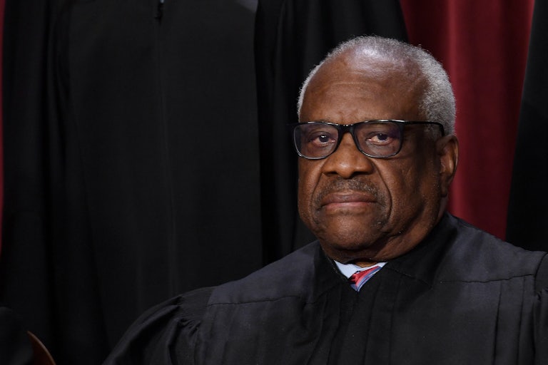 Clarence Thomas looks to the side