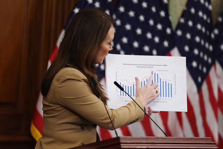U.S. Agriculture Secretary Brooke Rollins points to a graph chart on SNAP benefits during a news conference on Capitol Hill on October 31, 2025.