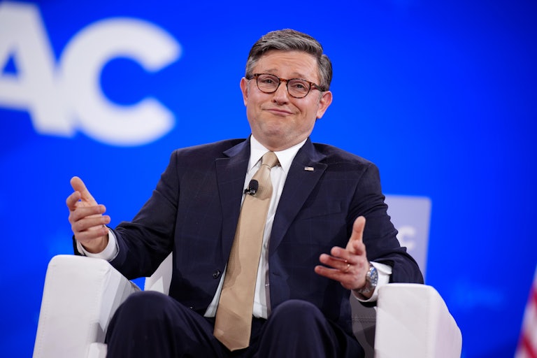 Mike Johnson leans back in a chair and looks like a doofus