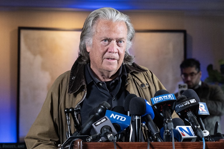 Steve Bannon speaks into microphones during a press conference