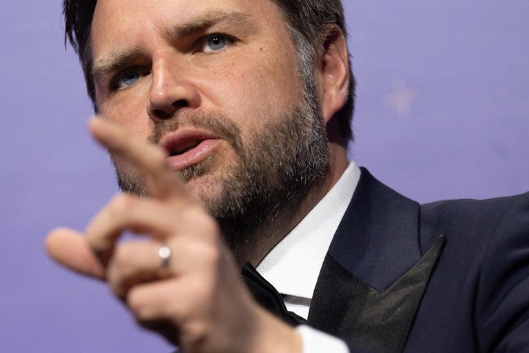 JD Vance speaks and points a finger