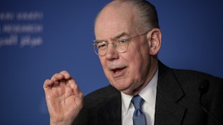 John Mearsheimer gesticulates while talking.