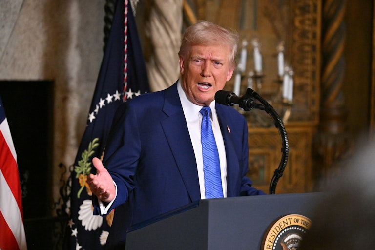 Donald Trump gestures while speaking during a press conference at Mar-a-Lago