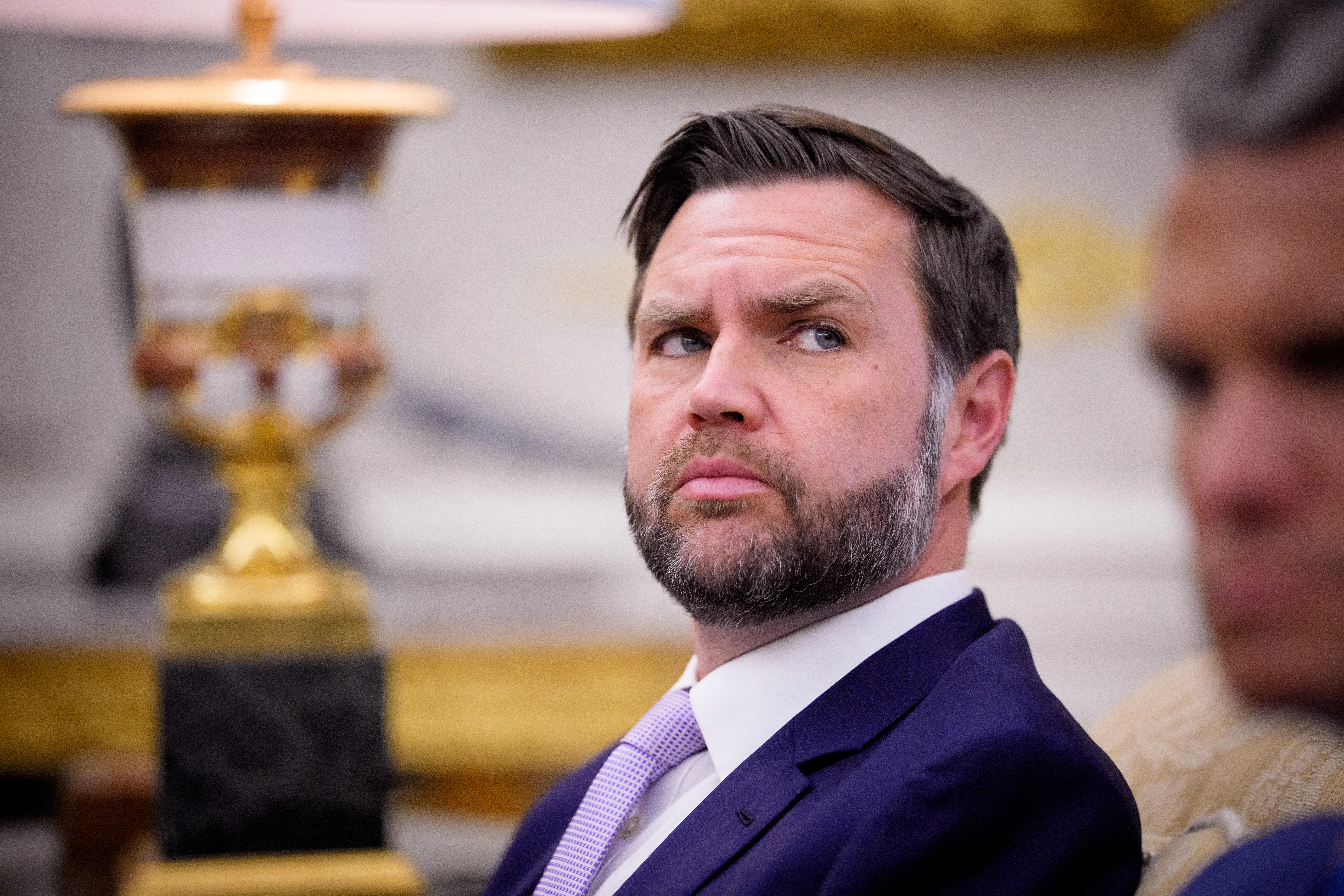 Vice President JD Vance looks sideways in a shifty manner