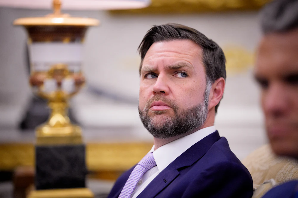 Vice President JD Vance looks sideways in a shifty manner