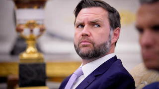 Vice President JD Vance looks sideways in a shifty manner