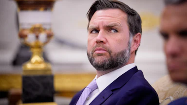 Vice President JD Vance looks sideways in a shifty manner