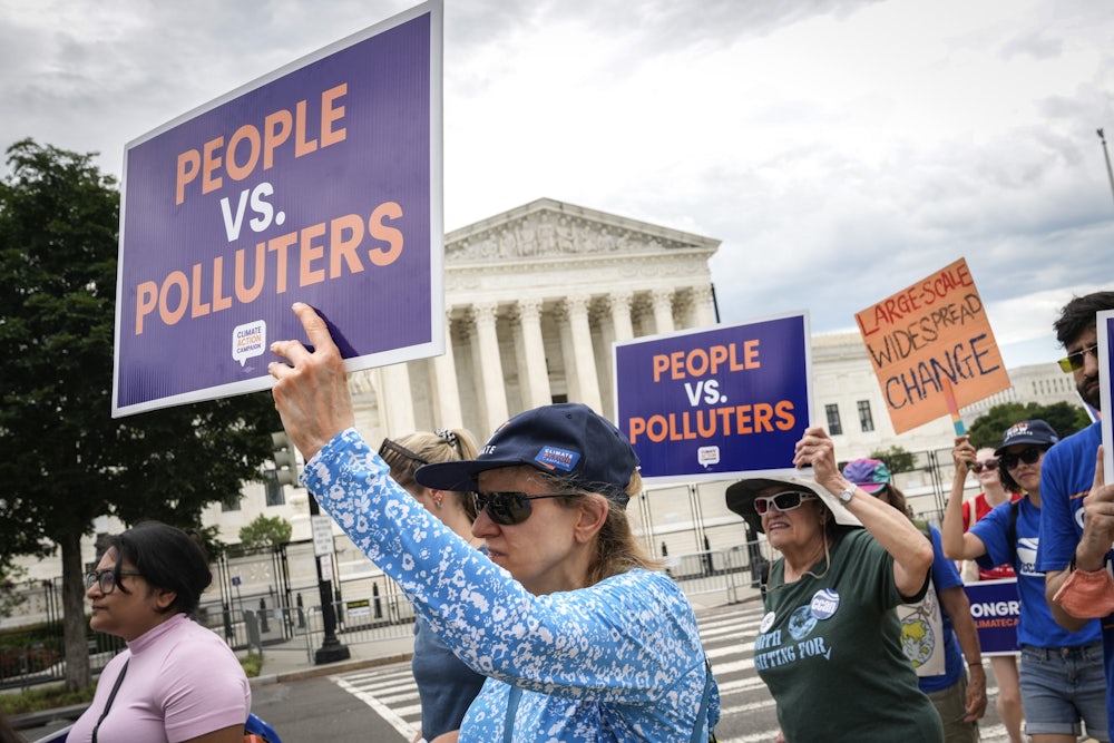 Environmental activists rally in front of the U.S. Supreme Court.