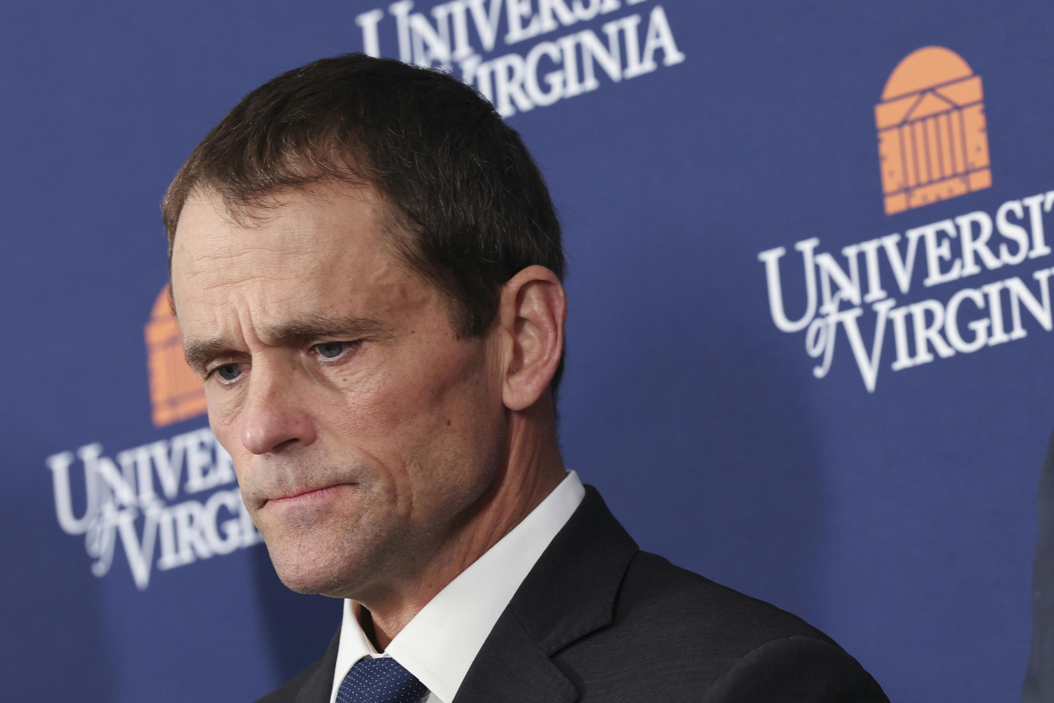 Former University of Virginia President James Ryan looks down during a press conference