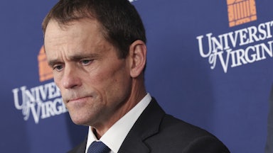 Former University of Virginia President James Ryan looks down during a press conference