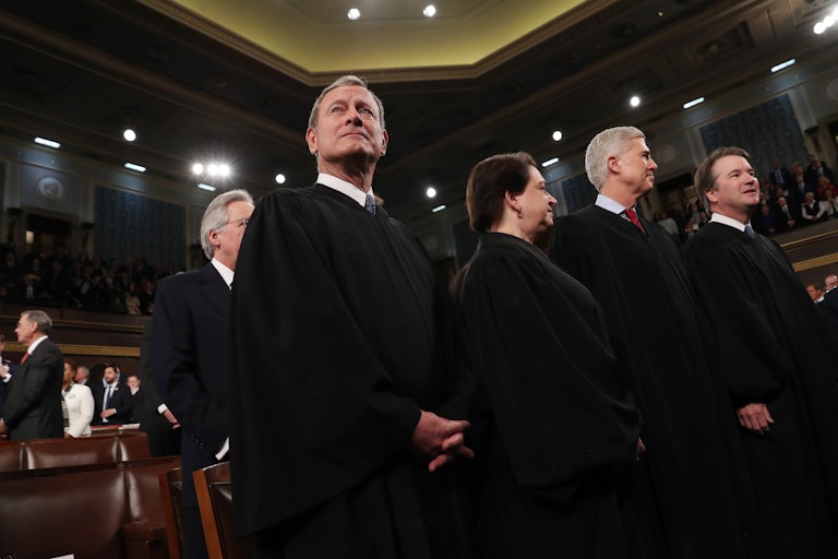  Chief Justice John Roberts waits to hear President Donald Trump deliver the State of the Union address. 