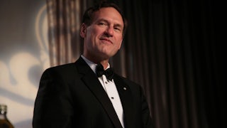 A tuxedo-clad Samuel Alito smirks.