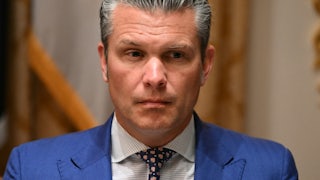 Defense Secretary Pete Hegseth sits during a meeting between Donald Trump and the Australian prime minister