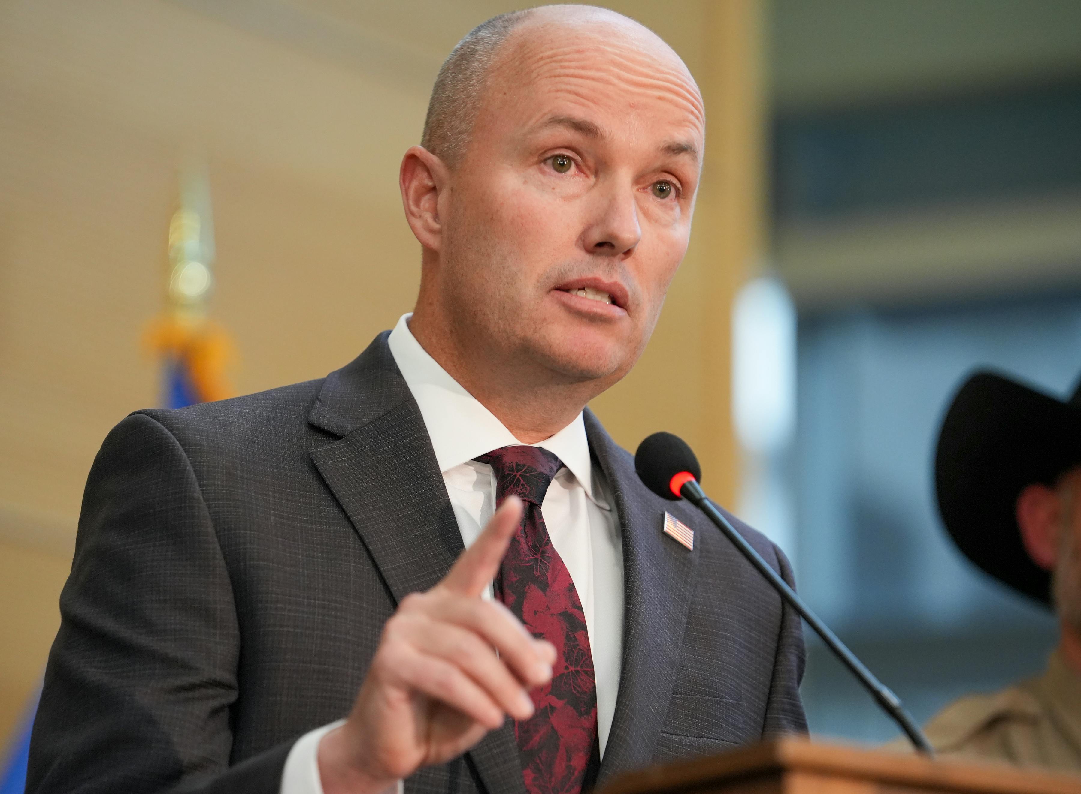Spencer Cox speaking at a press conference 