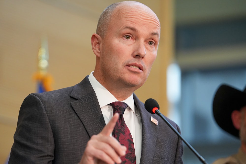 Spencer Cox speaking at a press conference