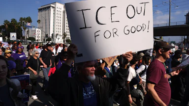 A person holds up a sign that says, "ICE out for good!" during an anti-ICE protest in Los Angeles, California.