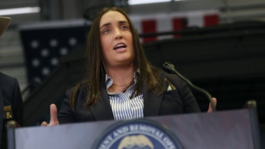 Former Deputy ICE Director Madison Sheahan gestures and speaks at a podium