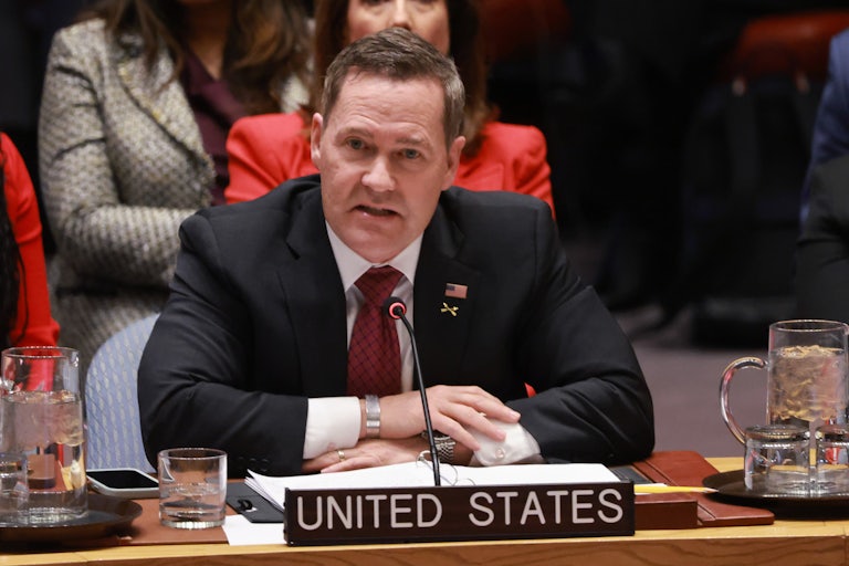 Mike Waltz speaks at the U.N. while seated behind the "United States" nameplate.