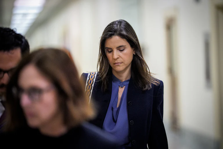 Jeffrey Epstein’s former assistant Sarah Kellen looks down while walking in Congress