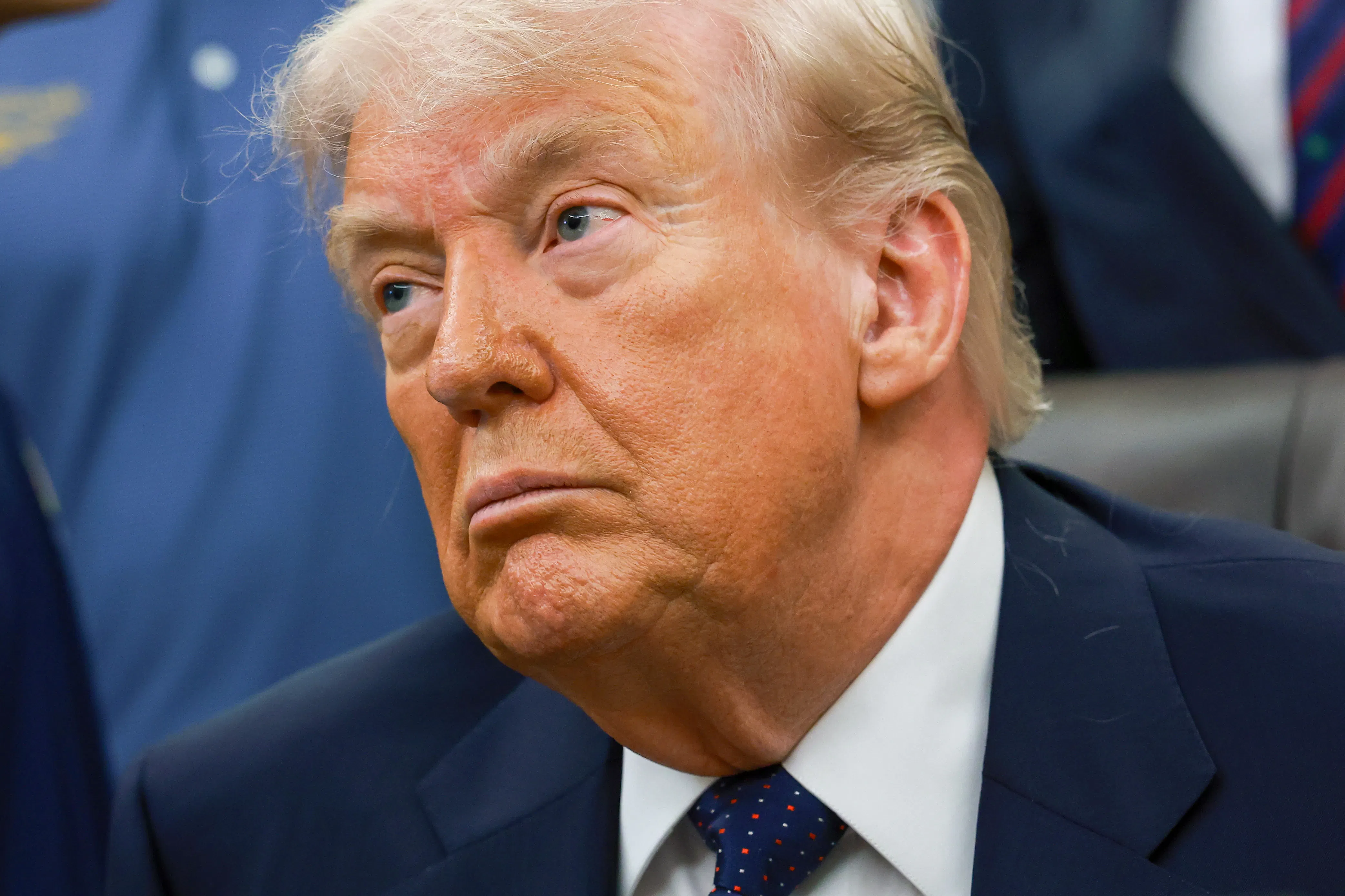 Donald Trump frowns listlessly