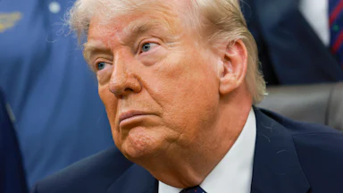 Donald Trump frowns listlessly