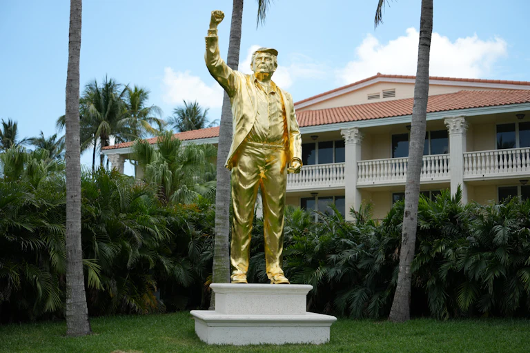 Golden statue of Donald Trump with his fist raised