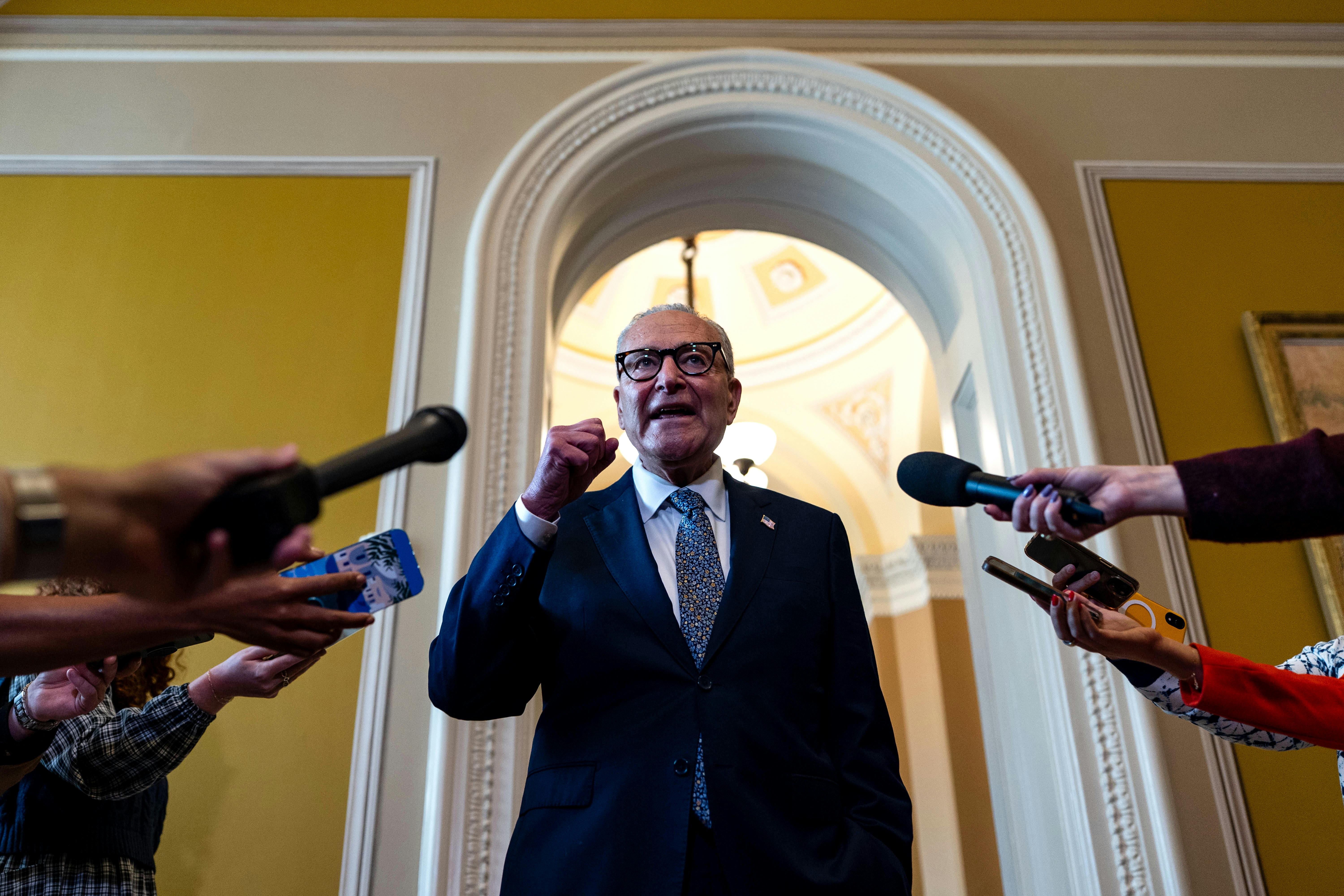 Chuck Schumer speaks with reporters outside of the Senate Chamber at the U.S. Capitol.