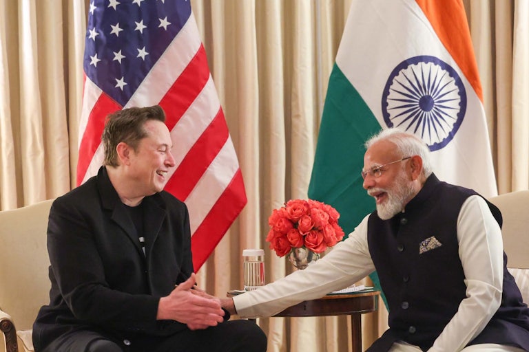 Elon Musk shakes hands with Indian Prime Minister Narendra Modi