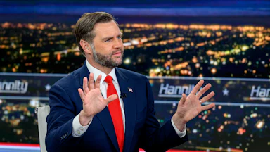 Vice President JD Vance holds up his hands while sitting on the set of Hannity