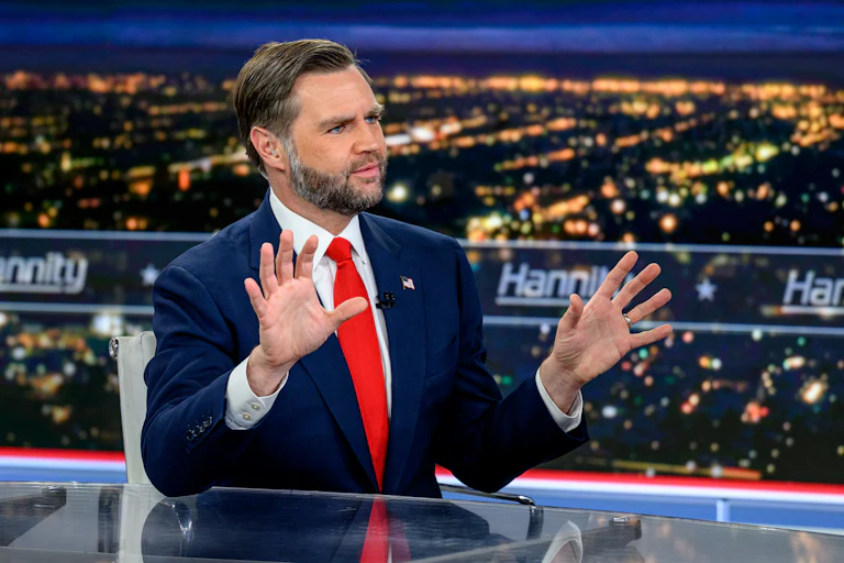 Vice President JD Vance holds up his hands while sitting on the set of Hannity