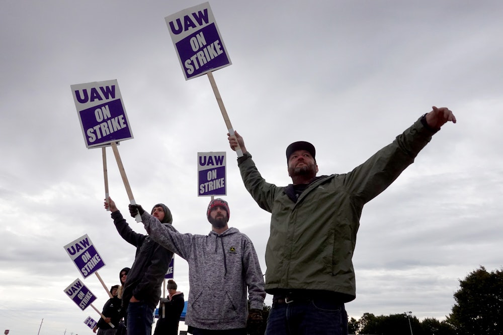 Striking workers picket outside of the John Deere Davenport Works facility on October 15, 2021 in Davenport, Iowa.