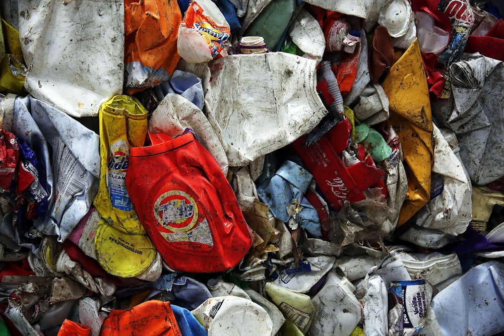 Flattened plastics are bunched together.