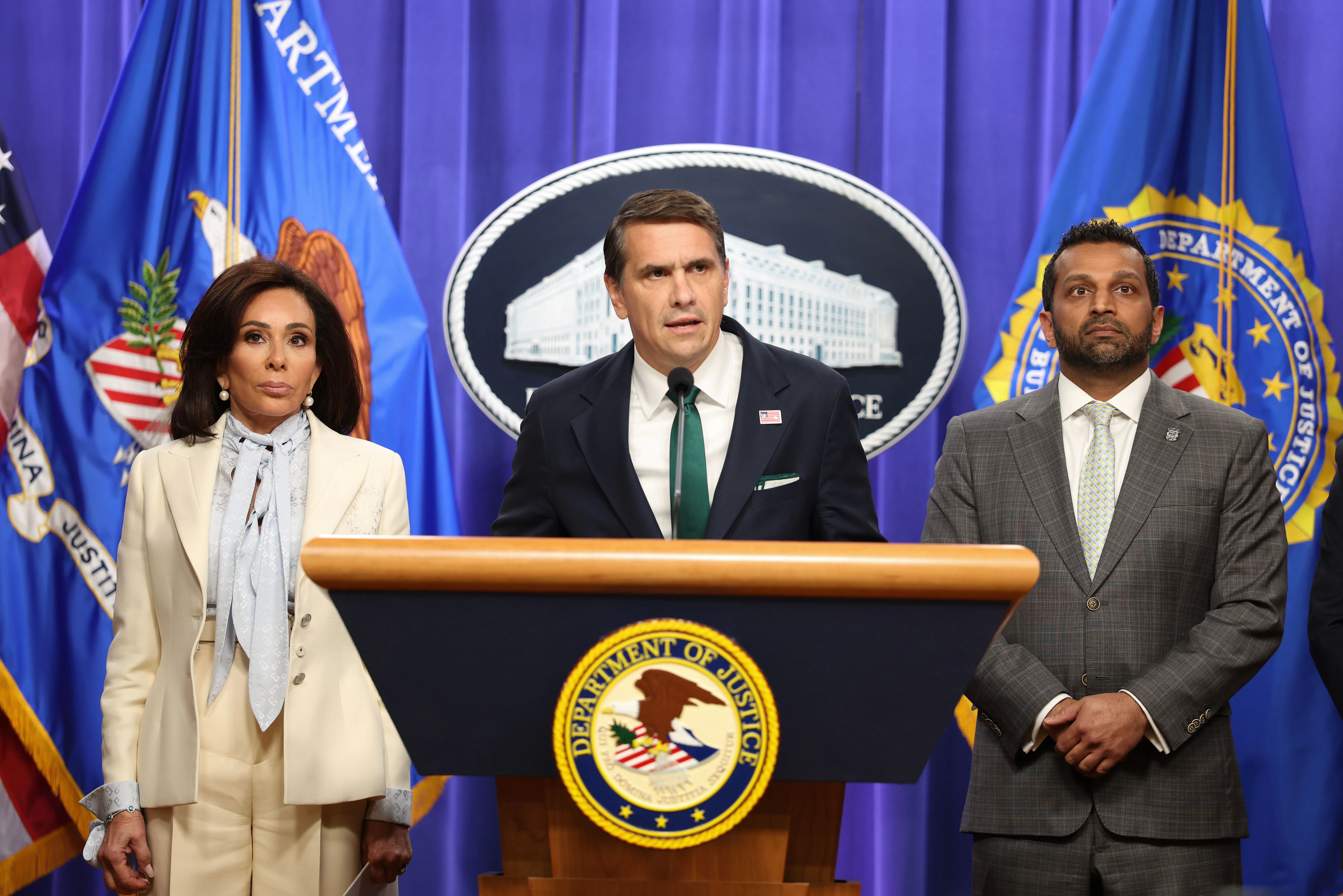 Acting Attorney General Todd Blanche speaks as U.S. Attorney Jeanine Pirro and FBI Director Kash Patel listen.
