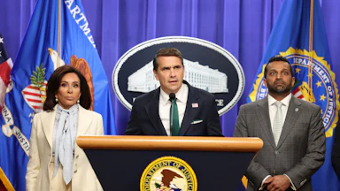 Acting Attorney General Todd Blanche speaks as U.S. Attorney Jeanine Pirro and FBI Director Kash Patel listen.