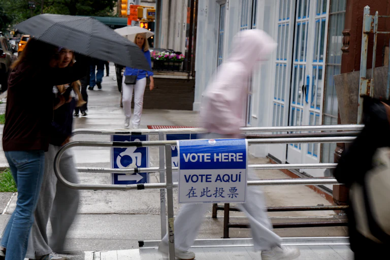 People walk into a voting station