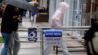 People walk into a voting station