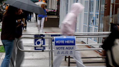 People walk into a voting station