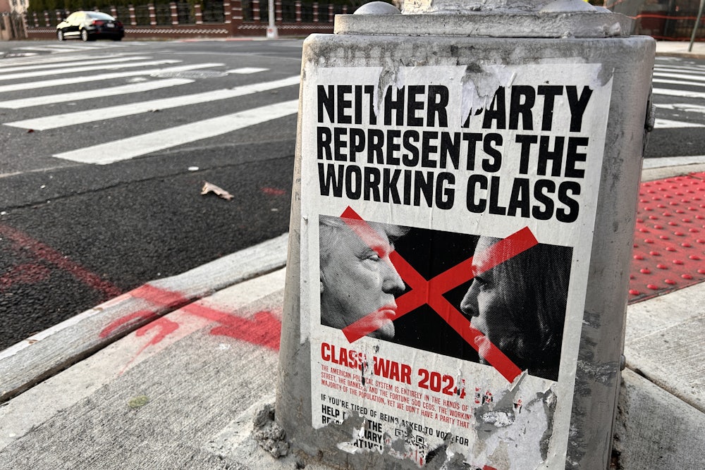 A poster reading "Neither Party represents the working Class" appears on a light pole in Queens, New York.